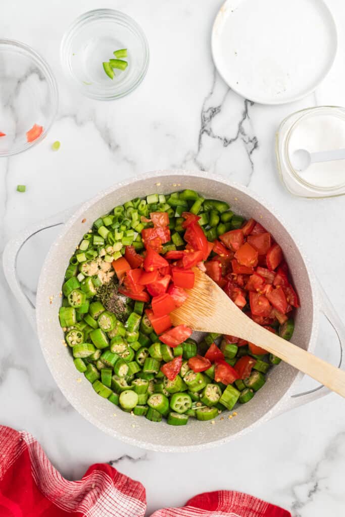 chopped tomatoes and spices added to a large pot