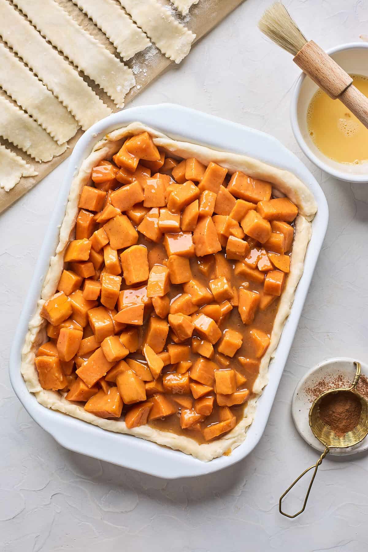 Sweet potato filling added on top of pie dough.