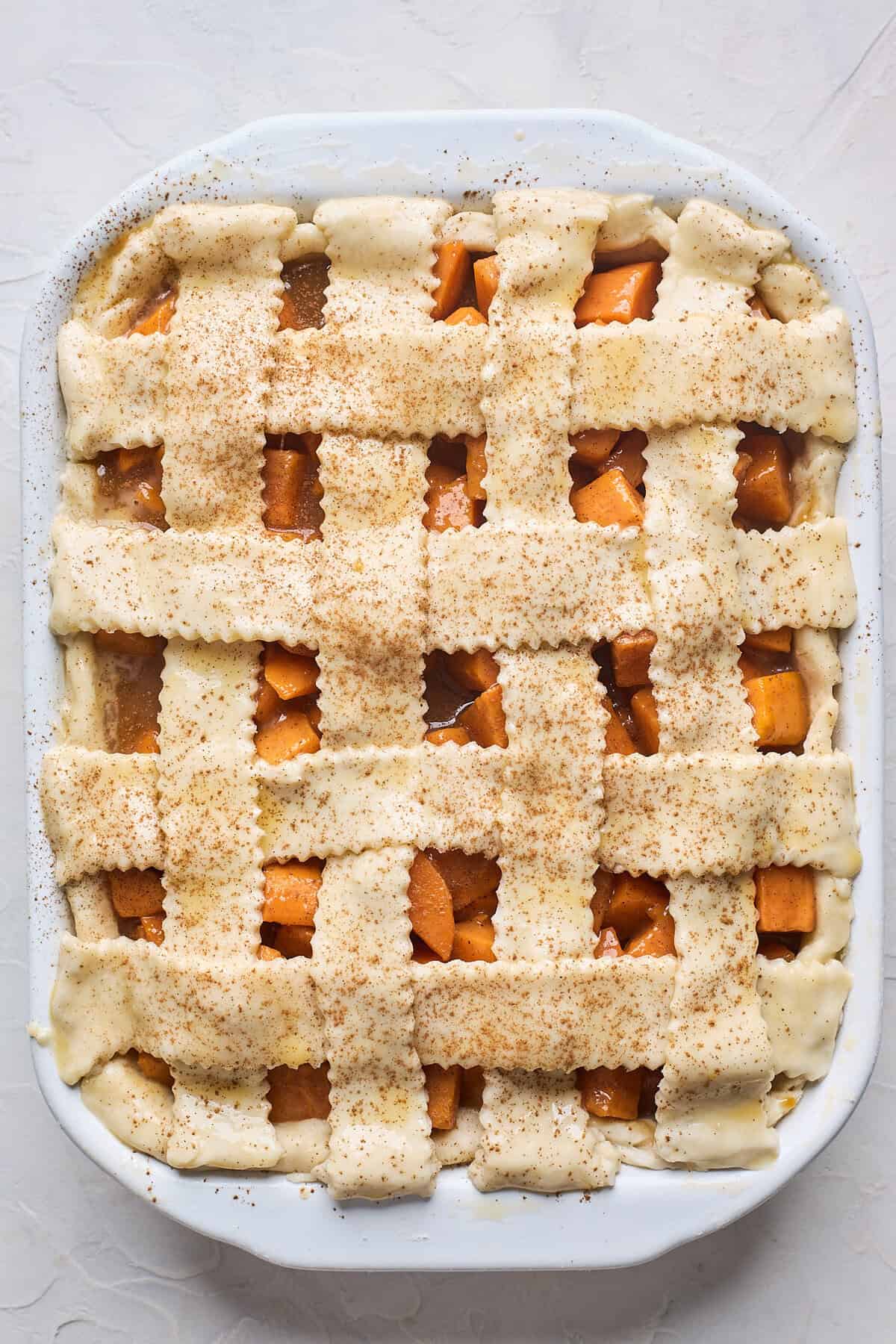 Completed lattice topping on a sweet potato cobbler recipe before baking