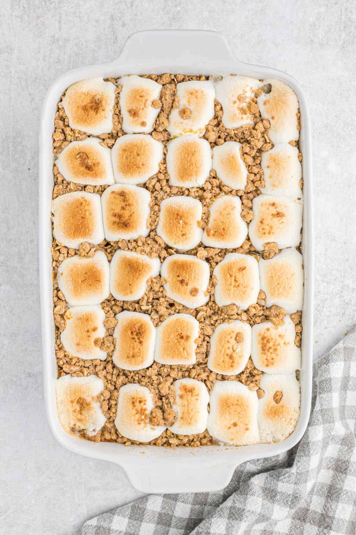 Baked southern sweet potato casserole with marshmallows.