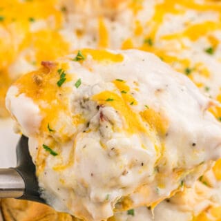 A large close up of a biscuits and gravy casserole ready to enjoy