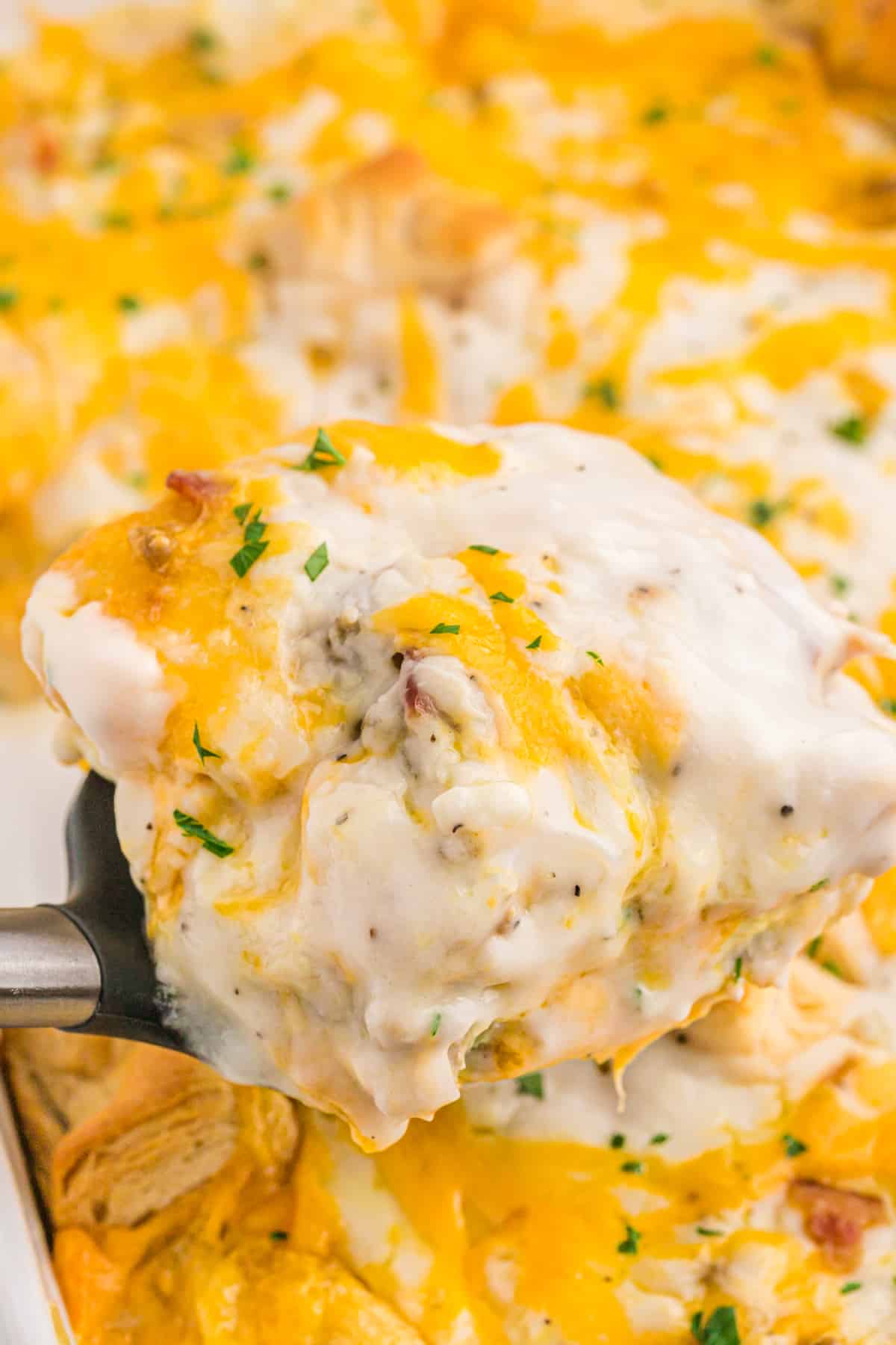 A large close up of a biscuits and gravy casserole ready to enjoy