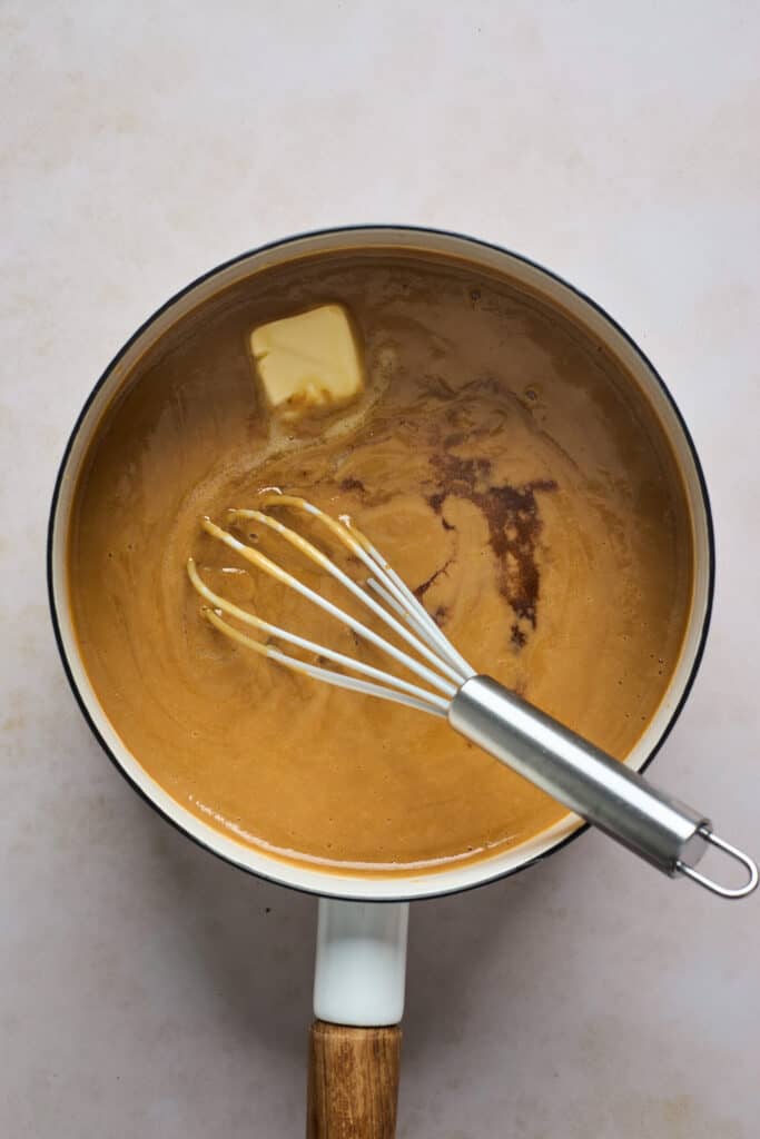 brown sugar mixture in a sauce pan being whisked