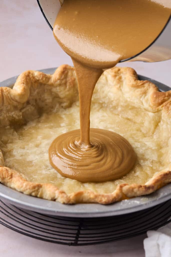 butterscotch mixture being poured into your prepared pie crust.