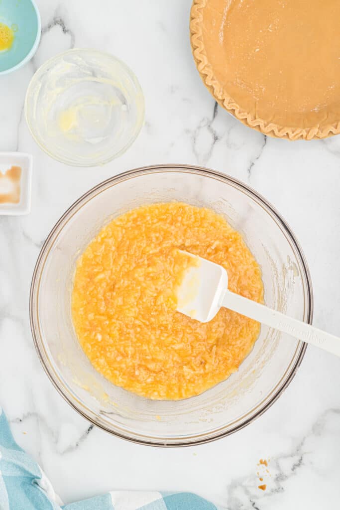 A mixing bowl of coconut pie filling.