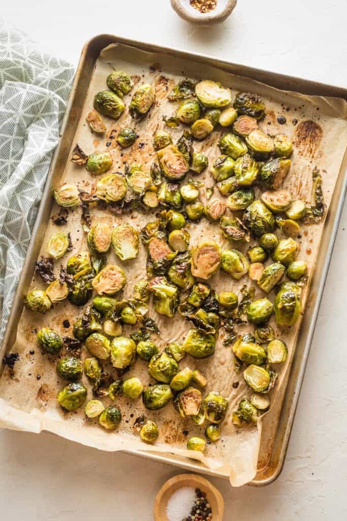 A large pan of roasted brussels sprouts out of the oven