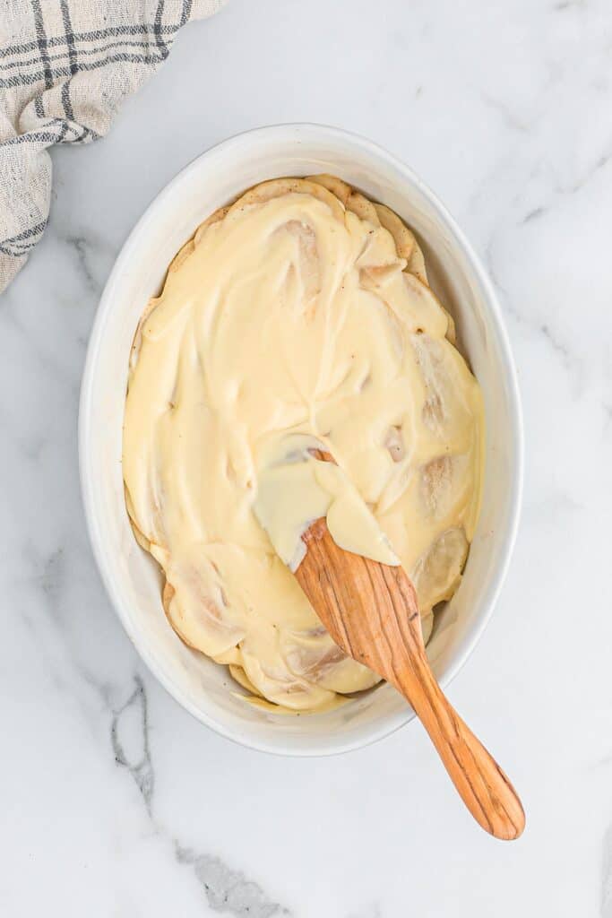 Cheese sauce spread over the top of the potatoes.