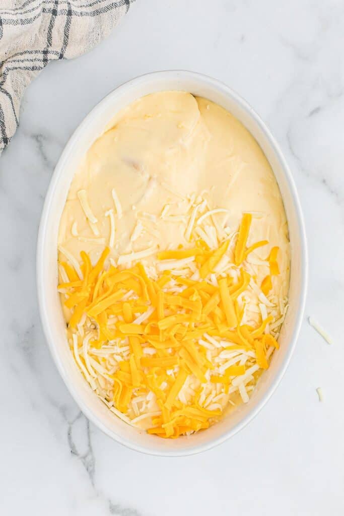 Cheese sprinkled over the top of the cream sauce.