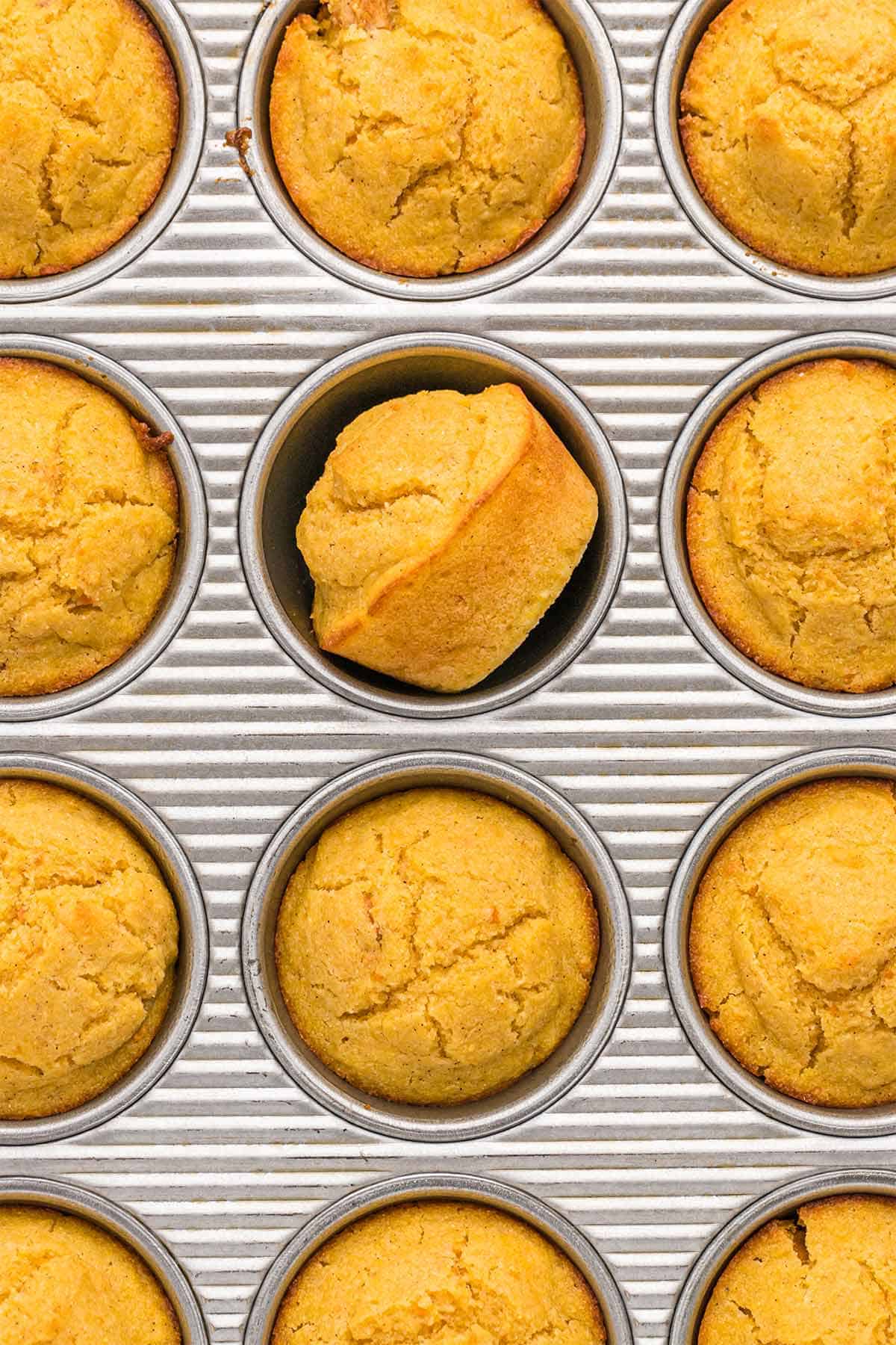 Baked sweet potato cornbread muffins in the pan cooked and ready to eat.