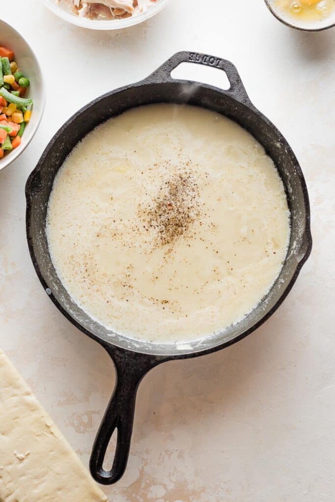 A roux/gravy in a cast iron skillet for pot pie filling.
