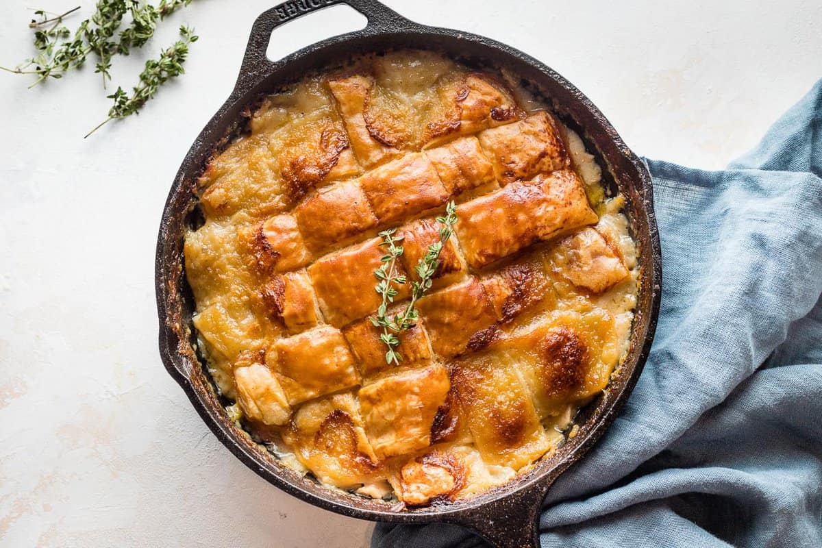 Baked turkey pot pie in a cast iron skillet.