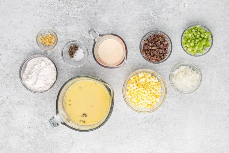 Ingredients to make turkey giblet gray in small bowls on a counter.