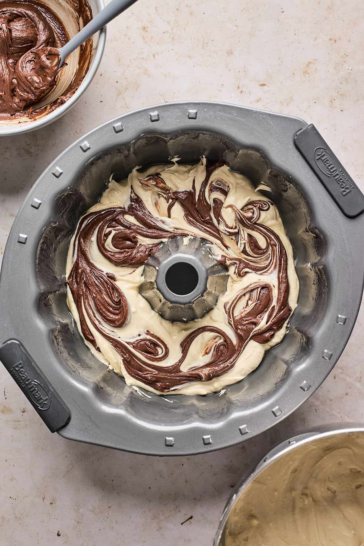 pound cake being assembled in a bundt pan