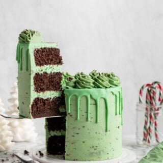 mint chocolate cake with a large slice being taken out