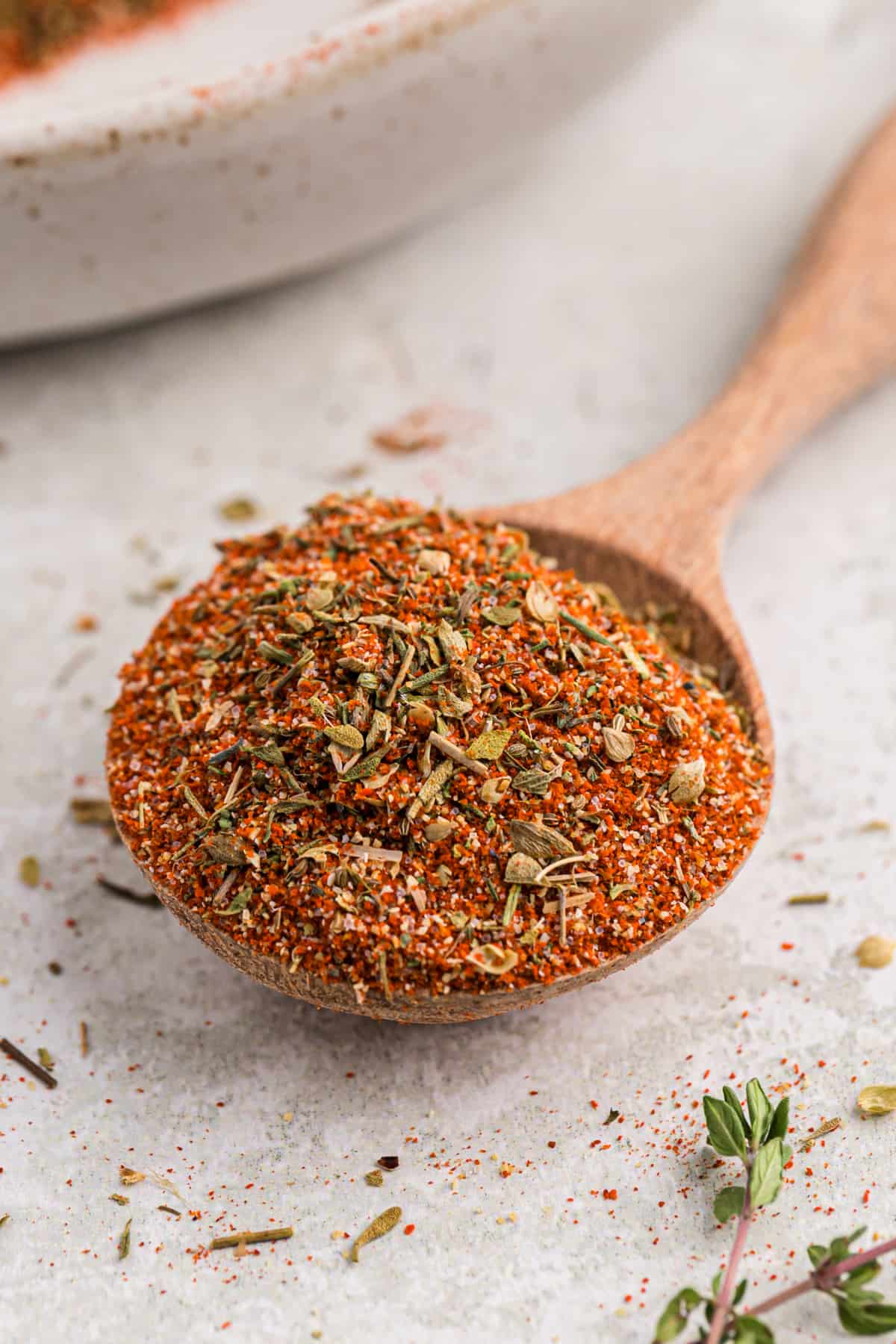 A wooden tablespoon filled with homemade blackened seasoning.