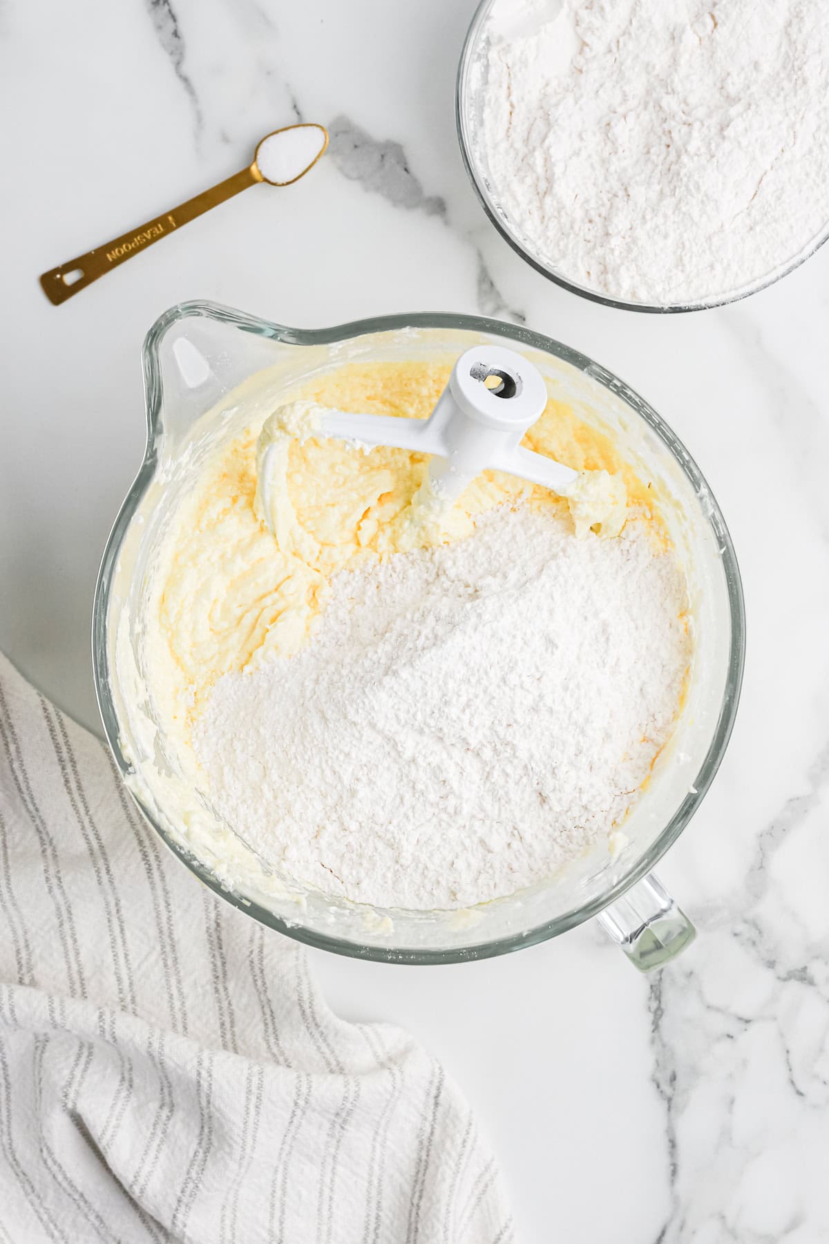 Flour being added to pound cake batter