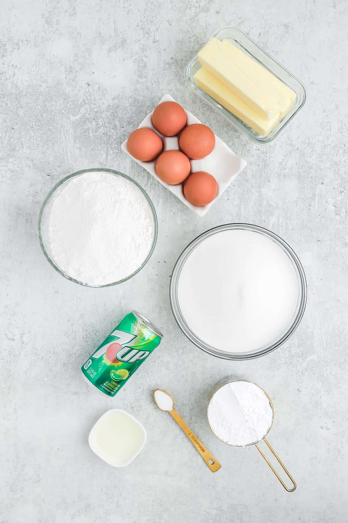 Ingredients to make a 7up cake on the counter.