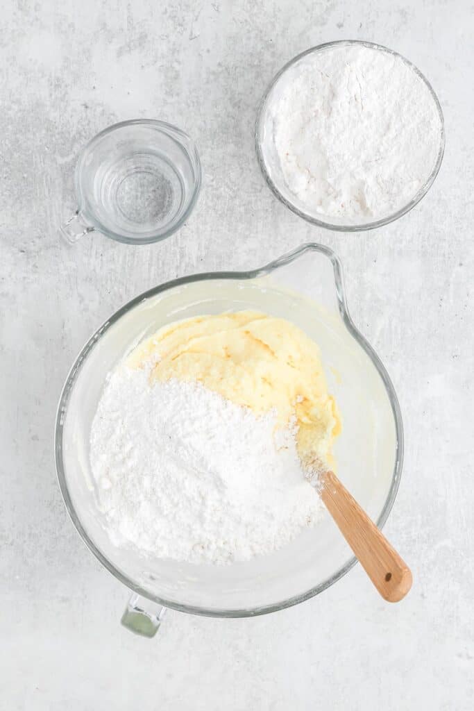 Flour added to a stand mixer bowl mixing 7 up pound cake recipe