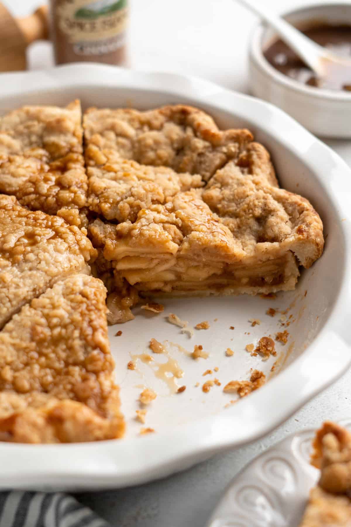 Sliced apple dutch pie in white pie plate