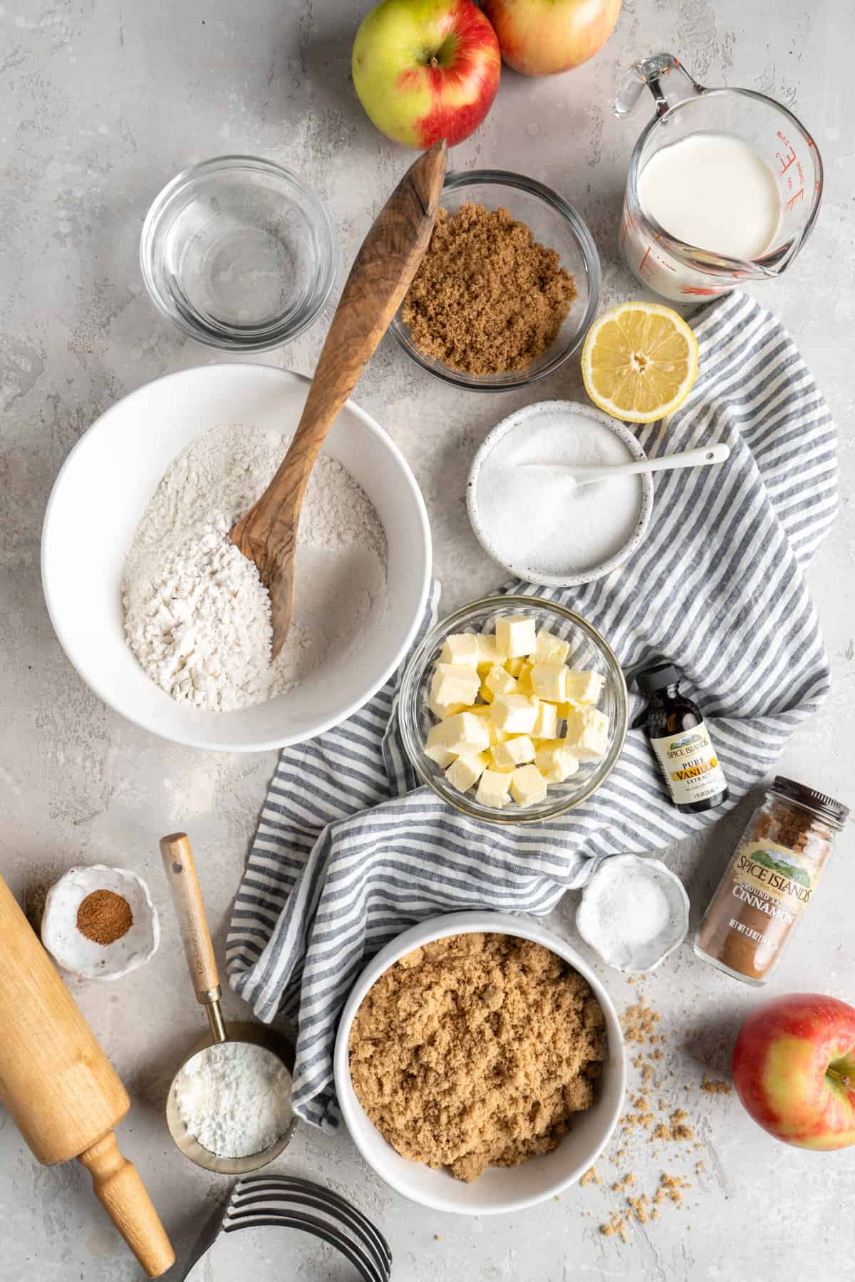 Ingredients in separate bowls to make an apple pie