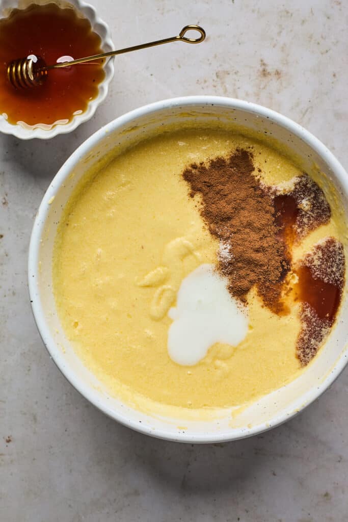 Spices and cream ready to be mixed into a honey custard base.