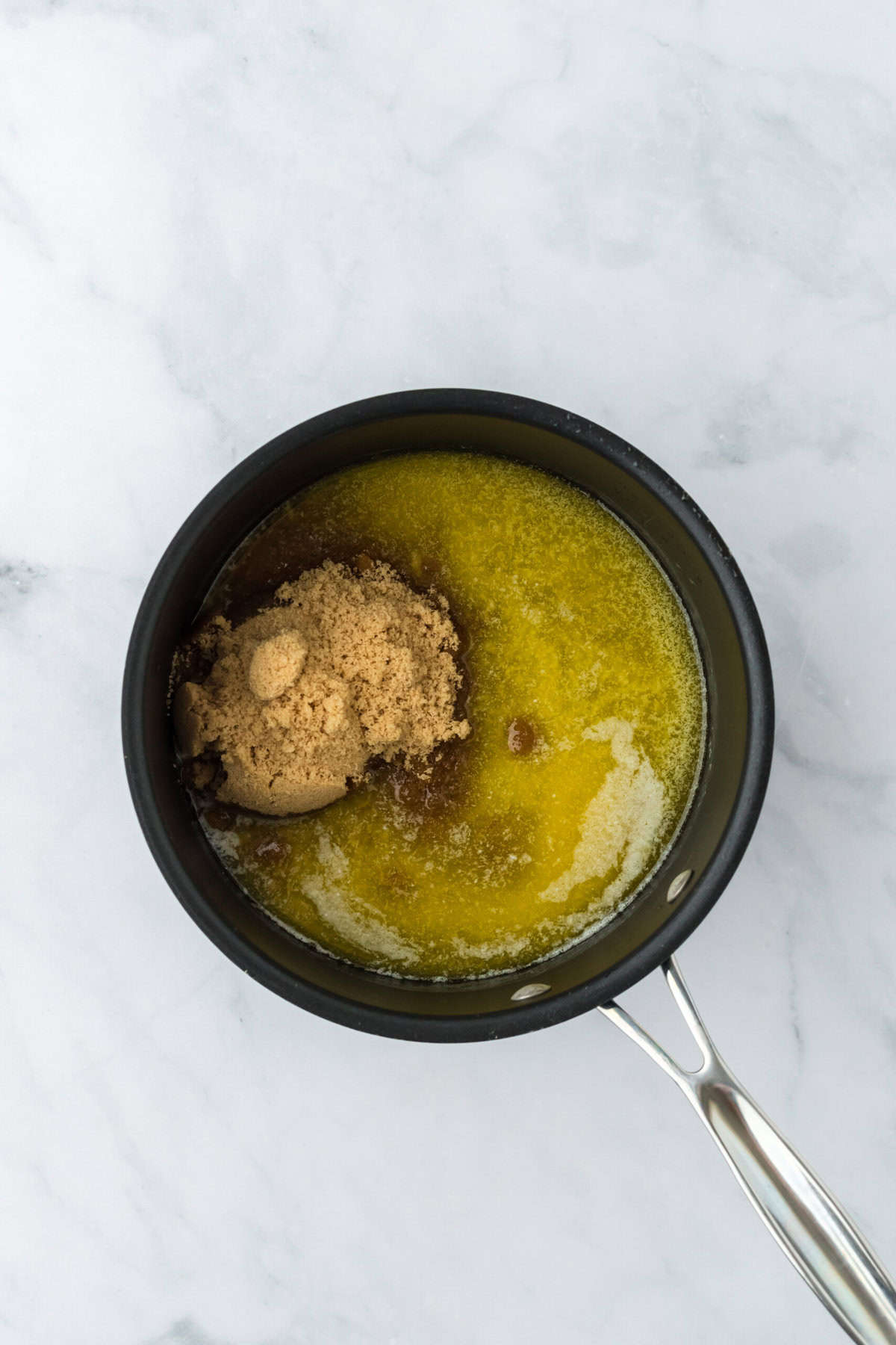 Butter and brown sugar in a saucepan melting together