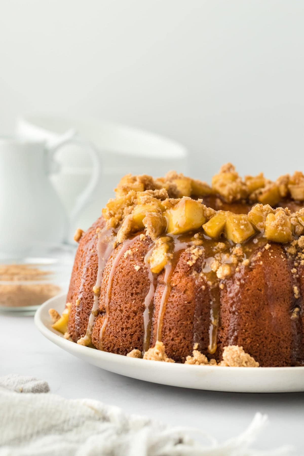 Caramel apple cake recipe on a white server in white background