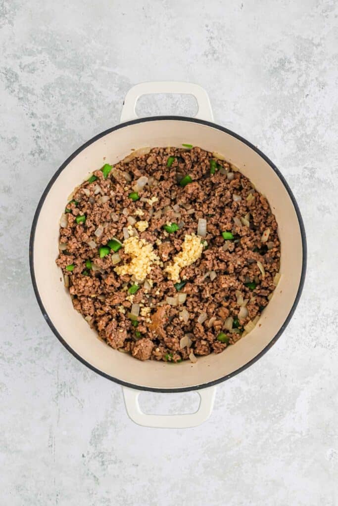 Cooked ground beef in a dutch oven.