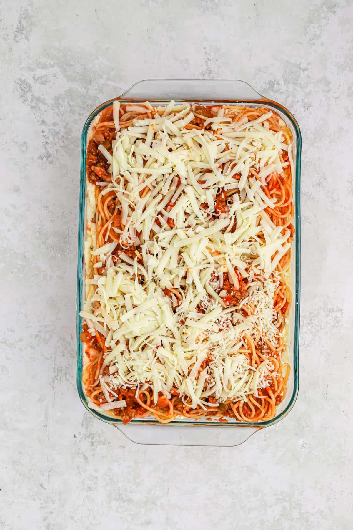Baked spaghetti in a dish ready to cook.