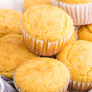 A close up of jiffy cornbread muffins stacked on top of each other
