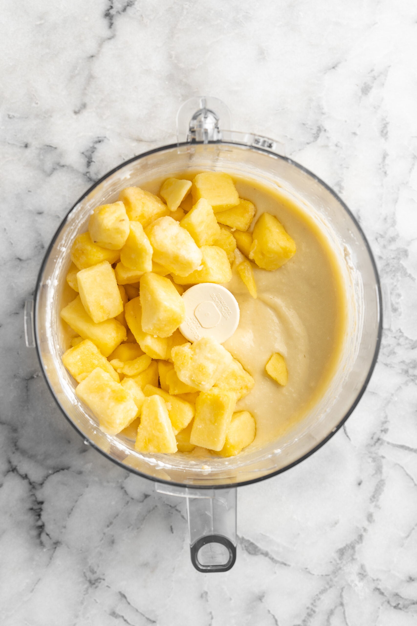 homemade dole whip ingredients in a food processor