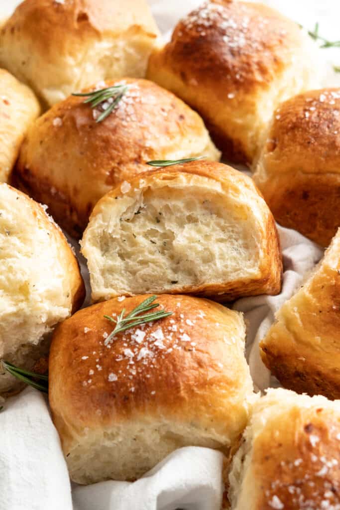 Side view of pull apart white cheddar rosemary dinner rolls.