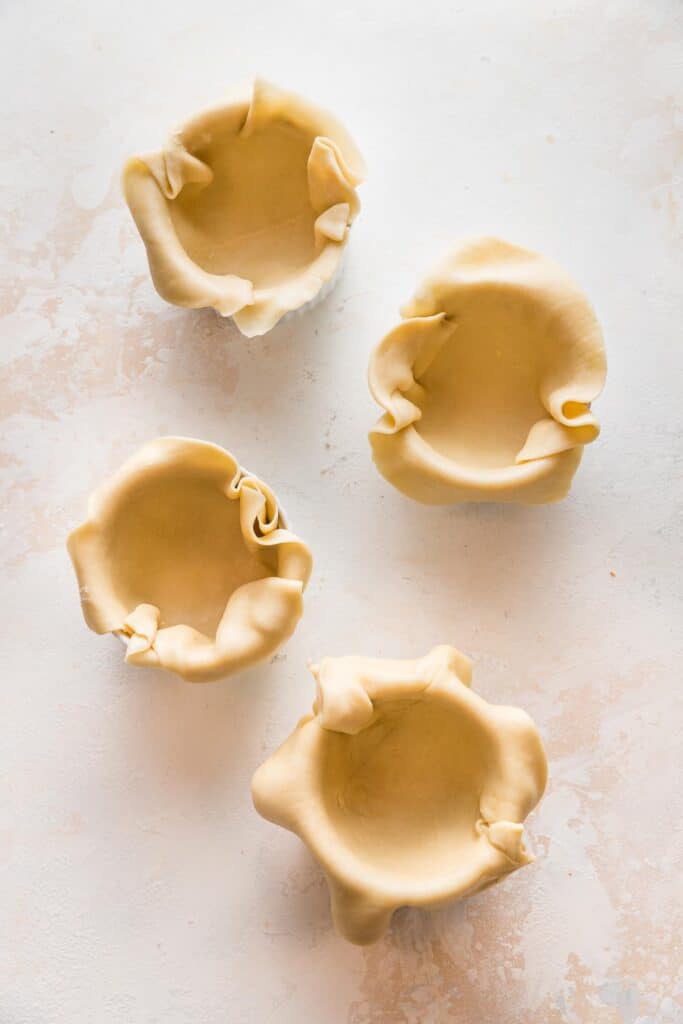 ramekins lined with pie dough 