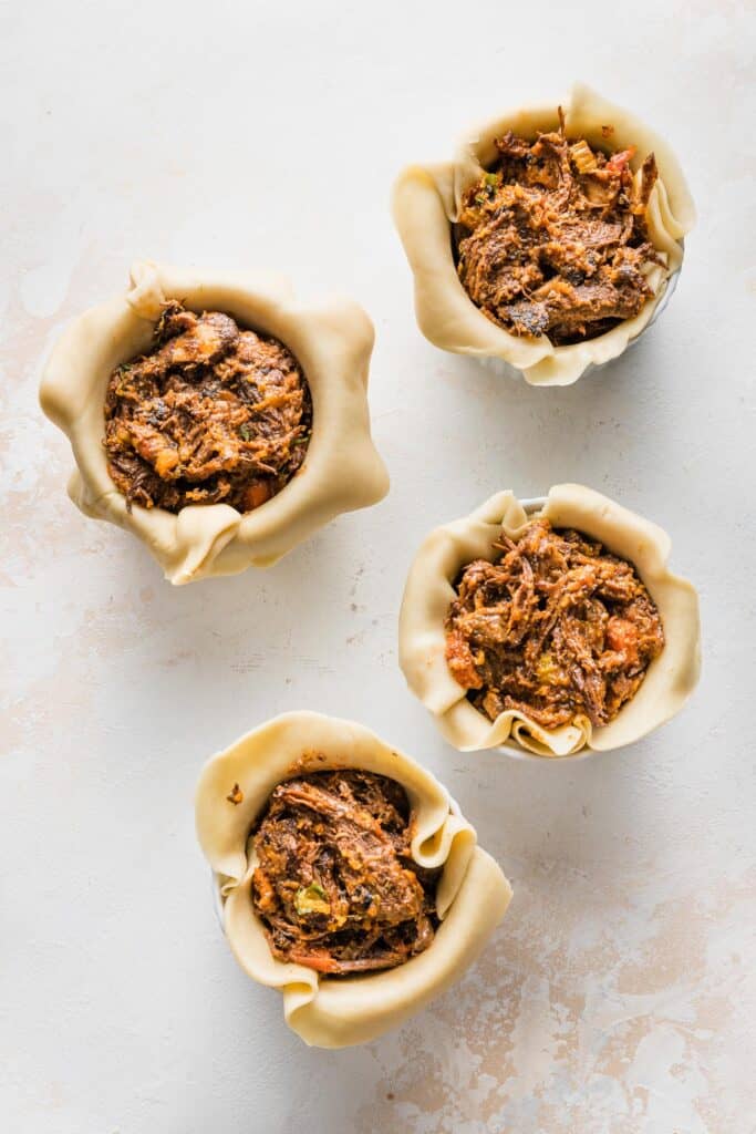 ramekins filled with steak pot pie filling