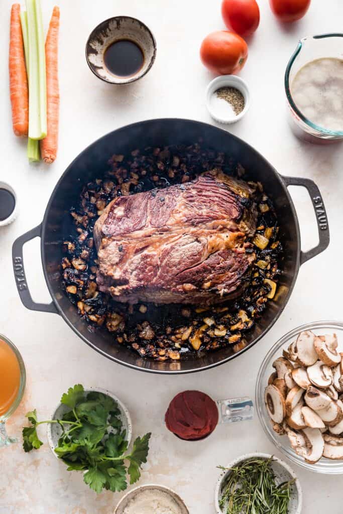 the beef is seared in the pot