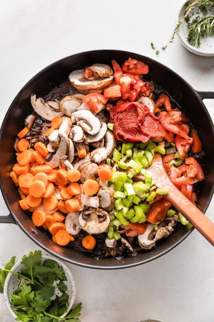 fresh veggies added to the pot of shredded beef.