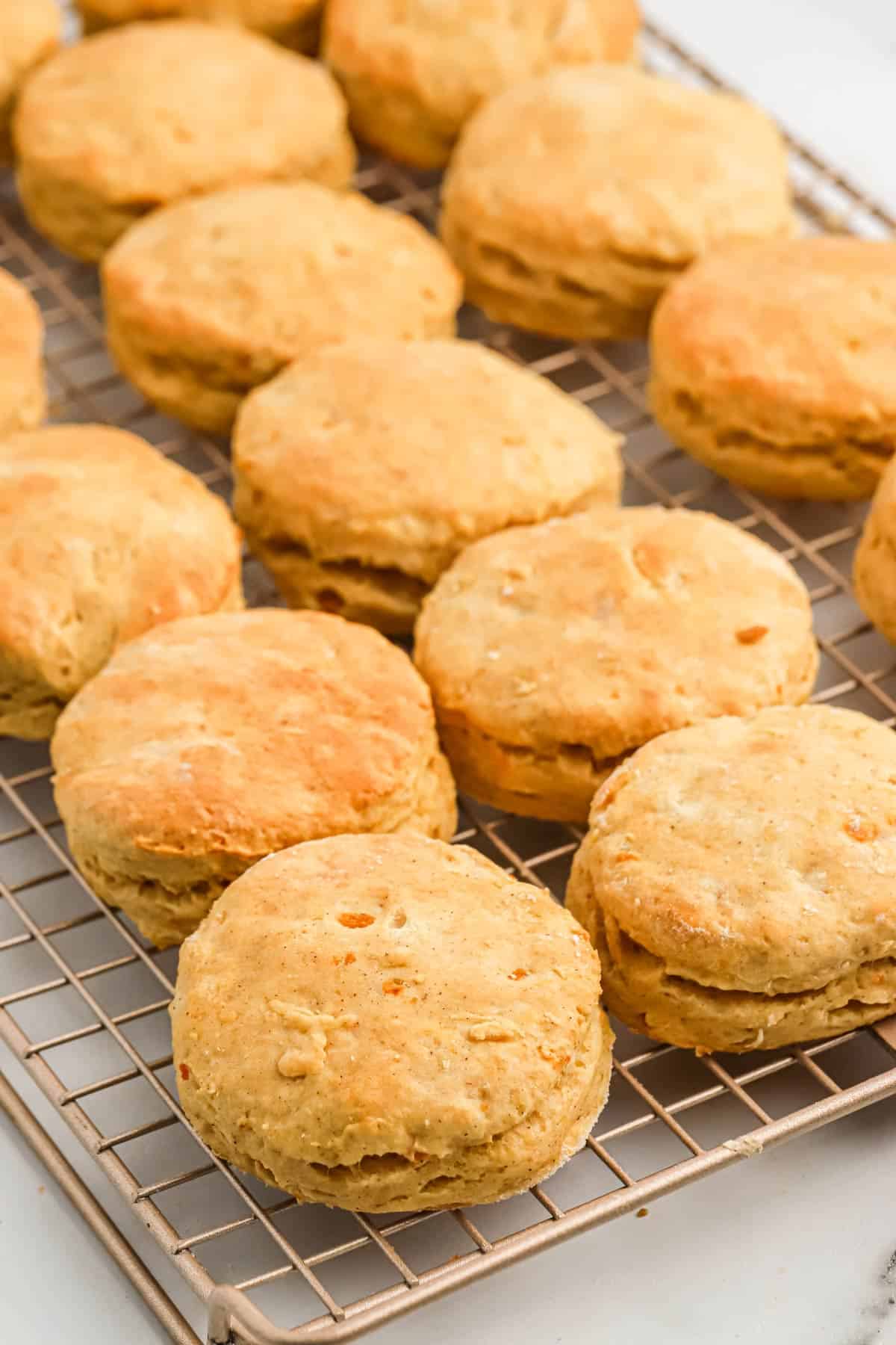 Baked sweet potato biscuits on a cooling rack.