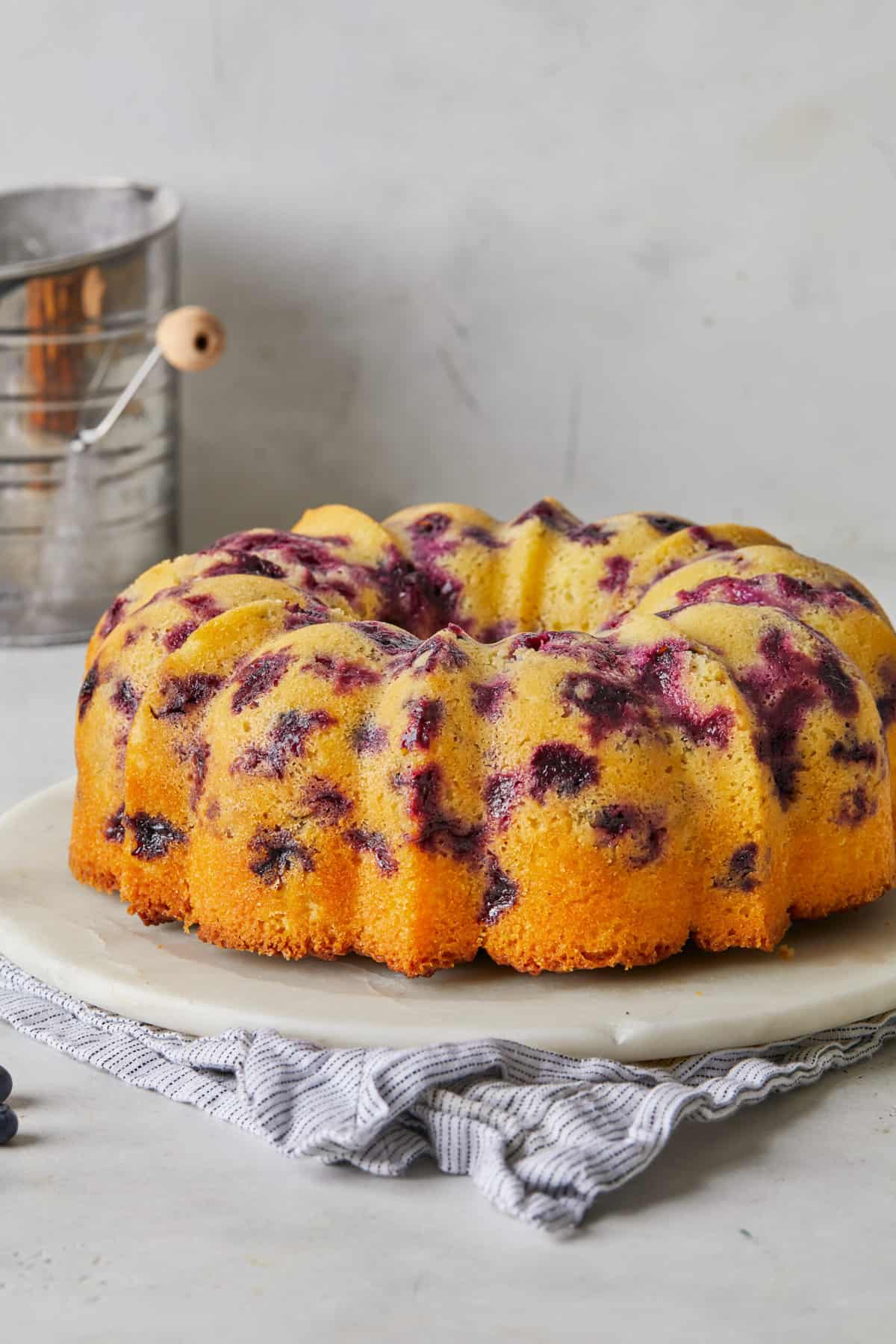 A beautiful bundt cake that's baked with blueberries