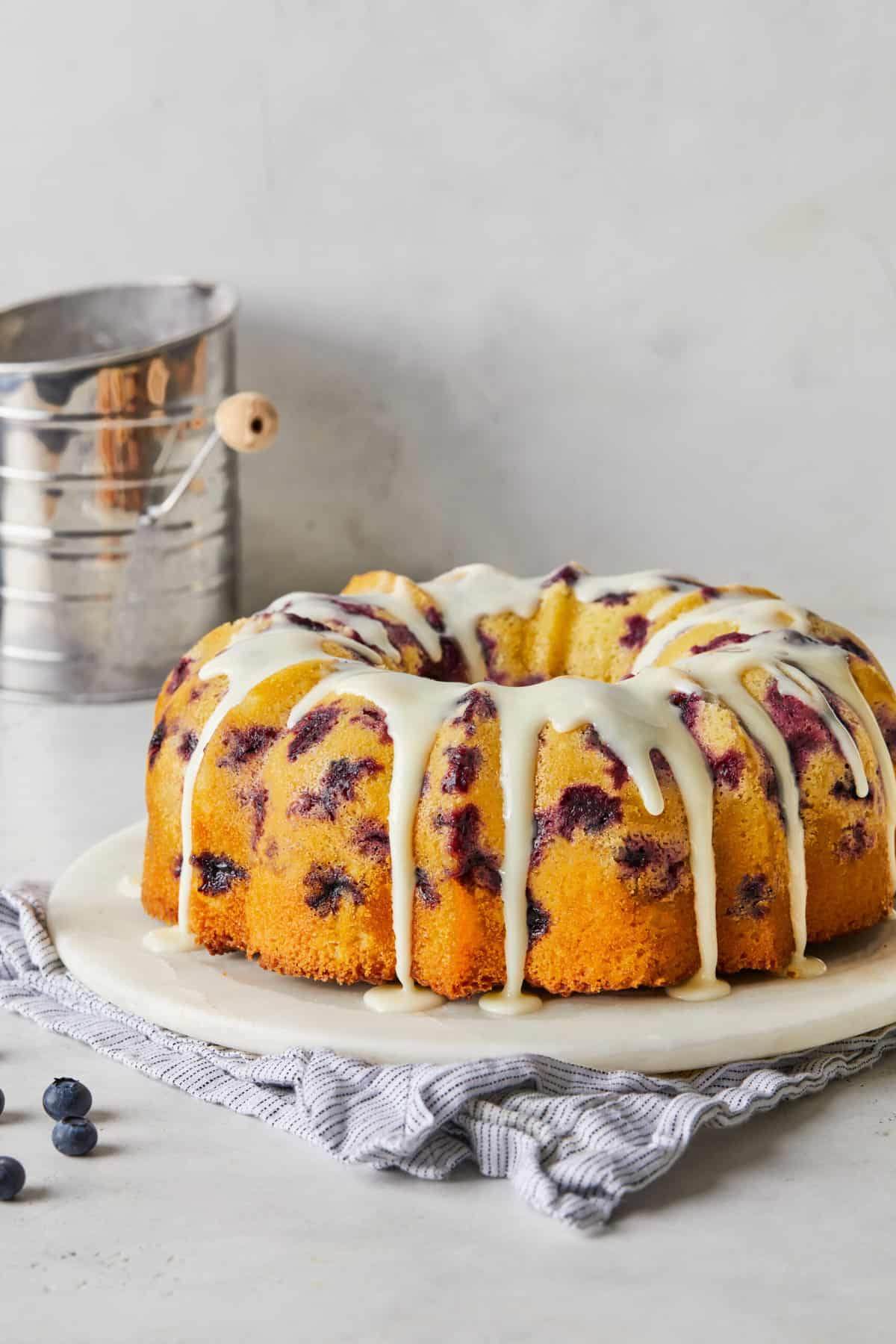 An icing on a blueberry orange pound cake ready to enjoy