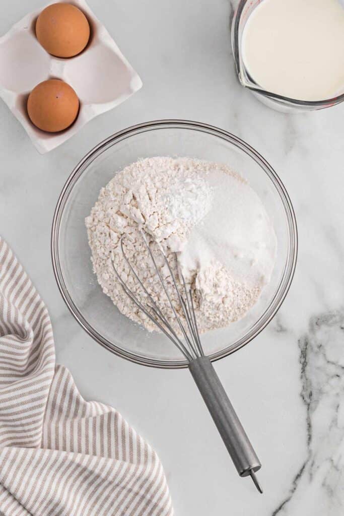Mixing the dry ingredients in a bowl.