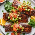 Sheet pan salmon with a cucumber salad on top