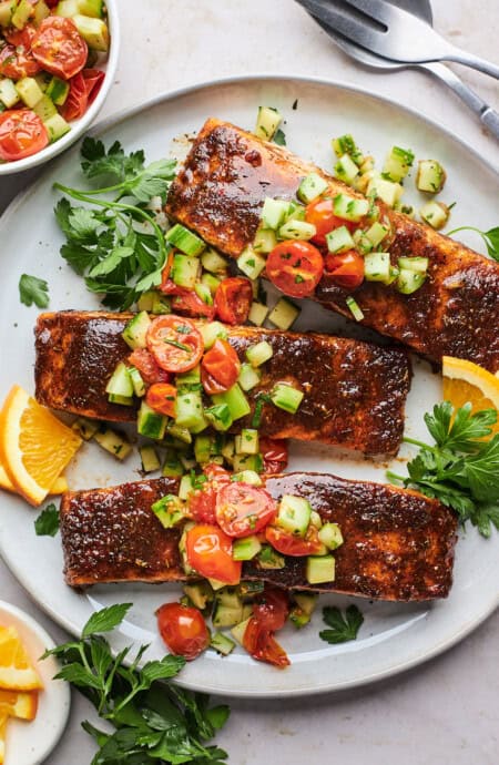 Sheet pan salmon with a cucumber salad on top