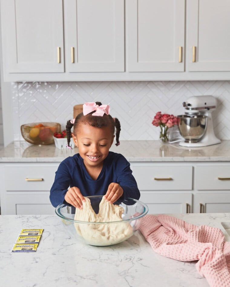 Harmony Adams kneading cinnamon roll dough