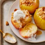Baked Crumble Appleson a silver platter with ice cream on one