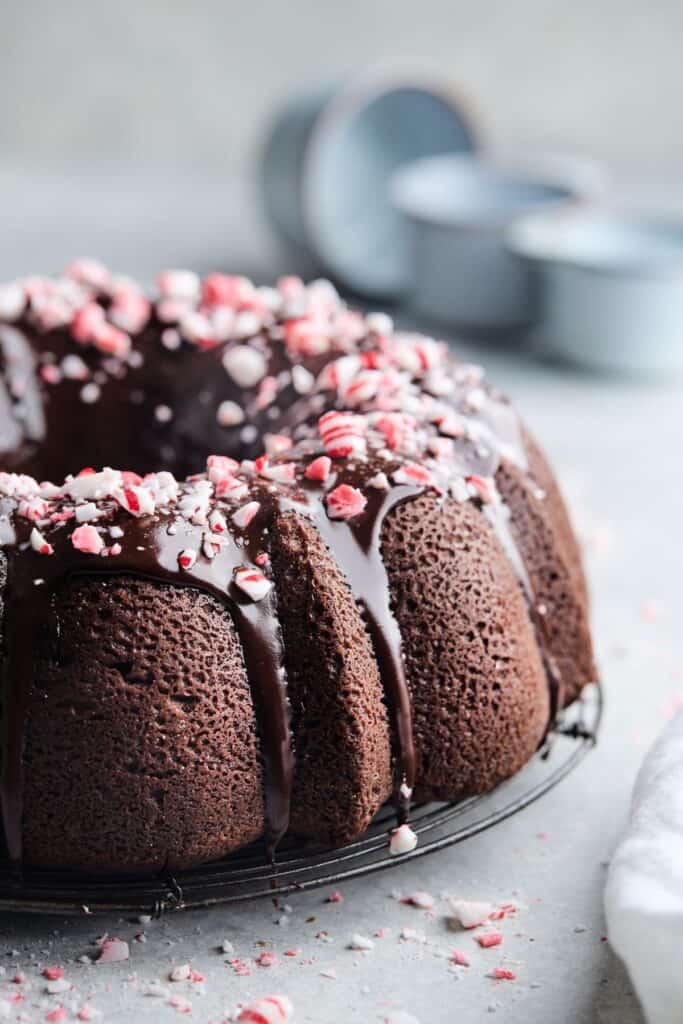 A close up of chocolate pound cake recipe with peppermint glaze and peppermint extract