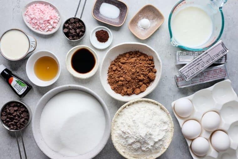 Ingredients to make chocolate peppermint cake on the table before mixing.