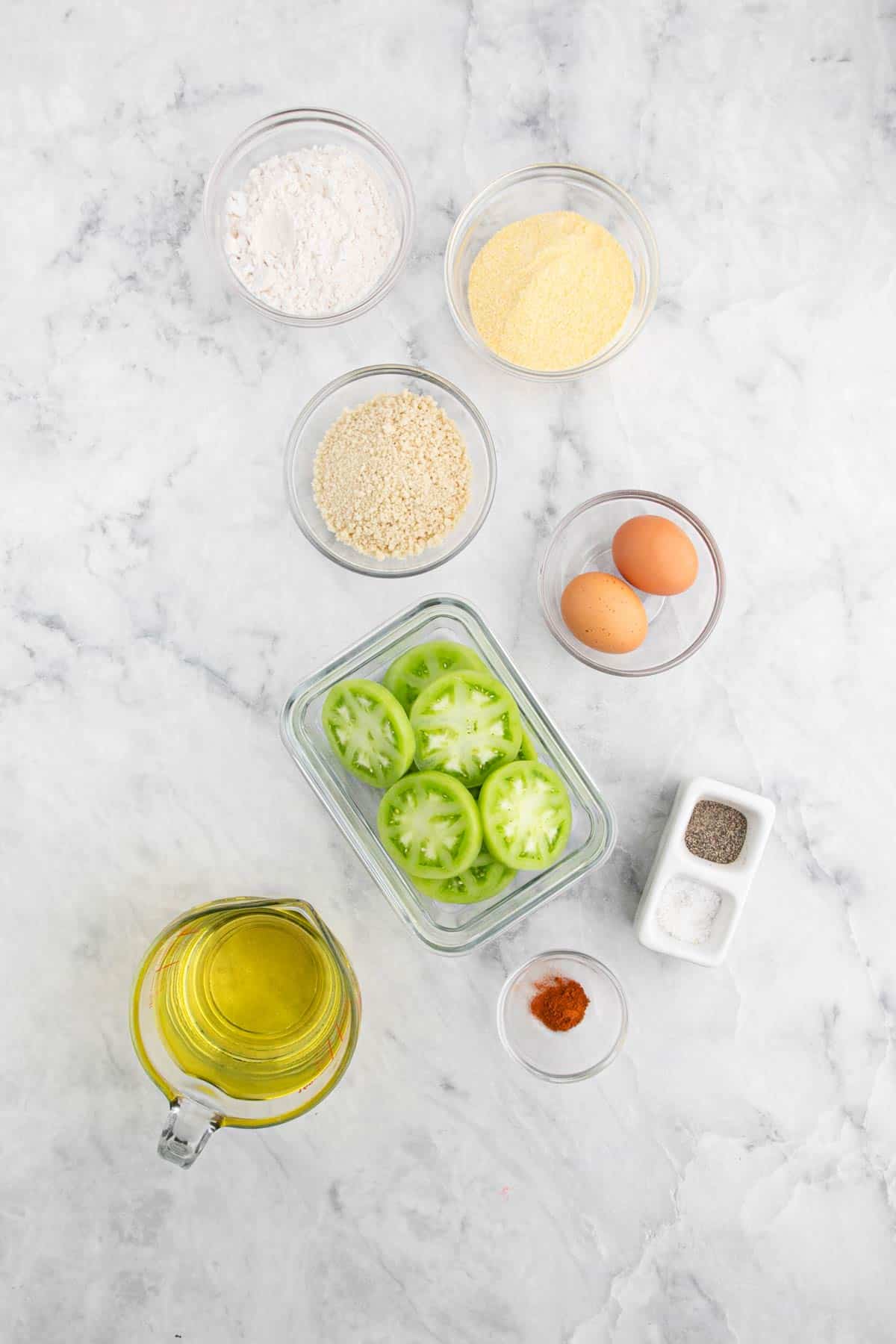 Ingredients to make southern fried green tomatoes on the counter before making.