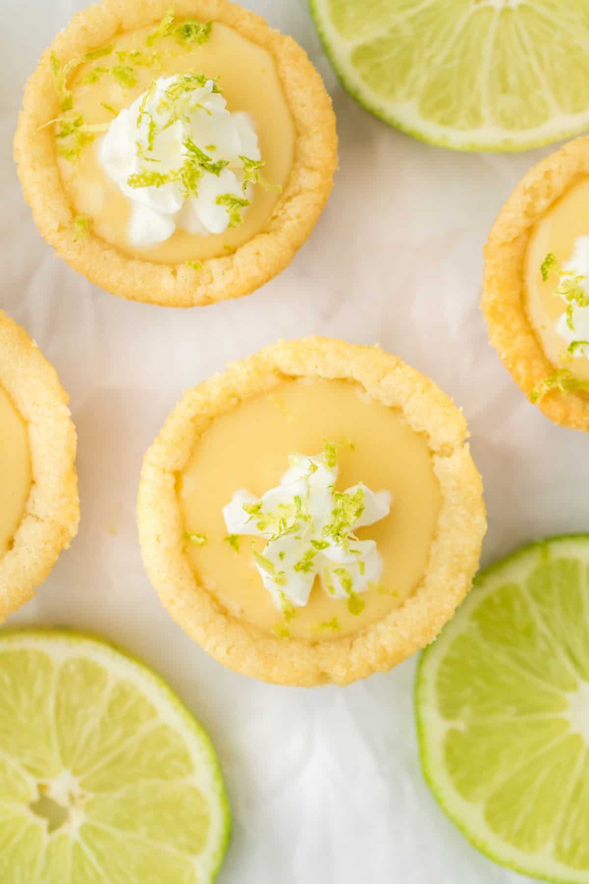 Close up of one key lime pie cookie cup with a couple more in the background