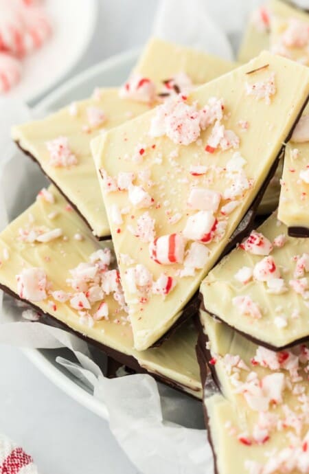 An assortment of peppermint bark in various flavors cut and ready to serve