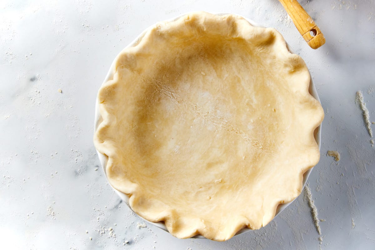 A perfect pie crust in a pie plate after baking.